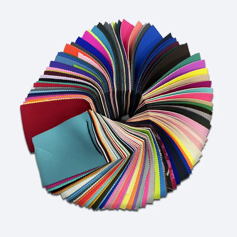 Neoprene Fabric Sample Swatches – NeopreneX Industrial NeopreneX premium neoprene fabric sample swatch wheel displaying various colors and technical laminations.