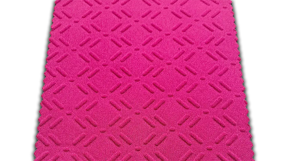 High-definition diagonal shot of Shark Skin and Diamond embossed neoprene patterns, highlighting the no mold fee advantage from NeopreneX