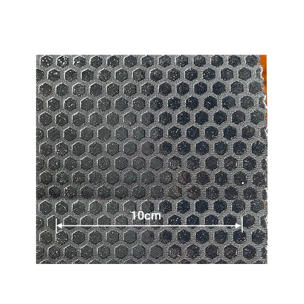 Black neoprene featuring glossy hexagonal silicone anti-slip dots for maximum friction in extreme environments.