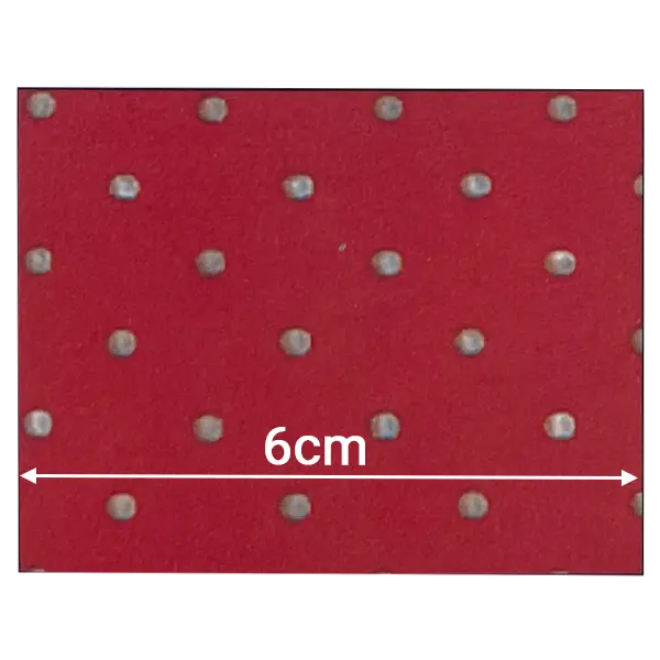 Bright red perforated neoprene fabric with standard industrial staggered air-flow holes.