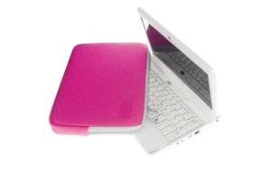 A premium magenta laptop sleeve made from embossed neoprene fabric with a precision small-diamond pattern, showcasing B2B product engineering and factory-direct textures.