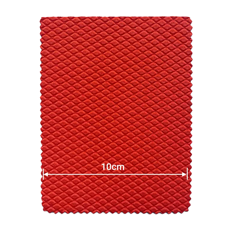 Red small diamond shark skin embossed neoprene fabric for manufacturing-scale production.