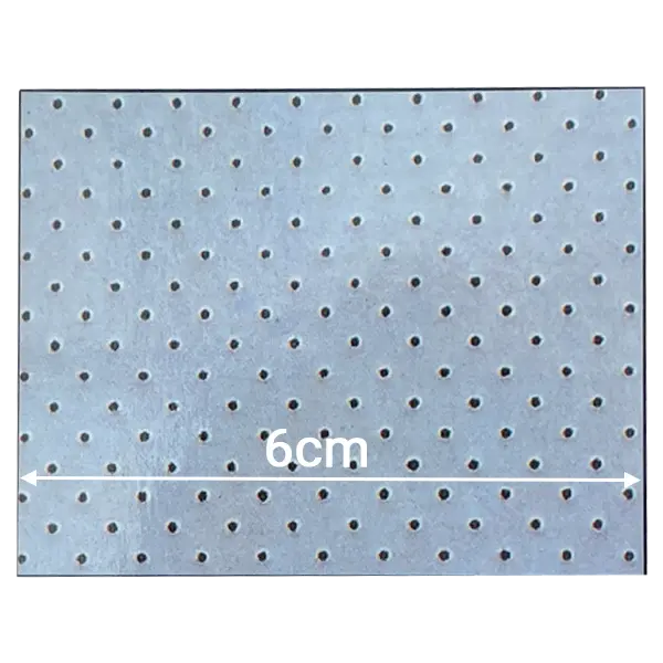 White perforated neoprene fabric with airy wide-spaced pinholes for medical compression gear.