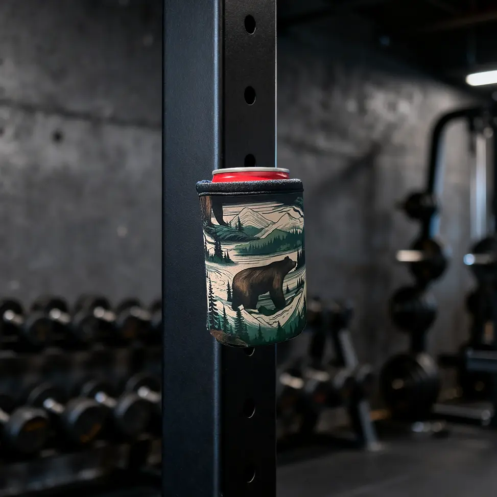Industrial N52 magnetic koozie blank attached to a gym rack, demonstrating the high-value hands-free utility for DIY fitness branding projects.