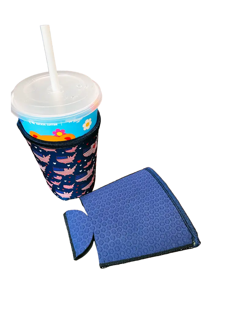 A finished custom neoprene coffee sleeve with a high-definition US flag sublimation pattern on a cup, showcasing vibrant branding and blue hexagonal embossed texture.