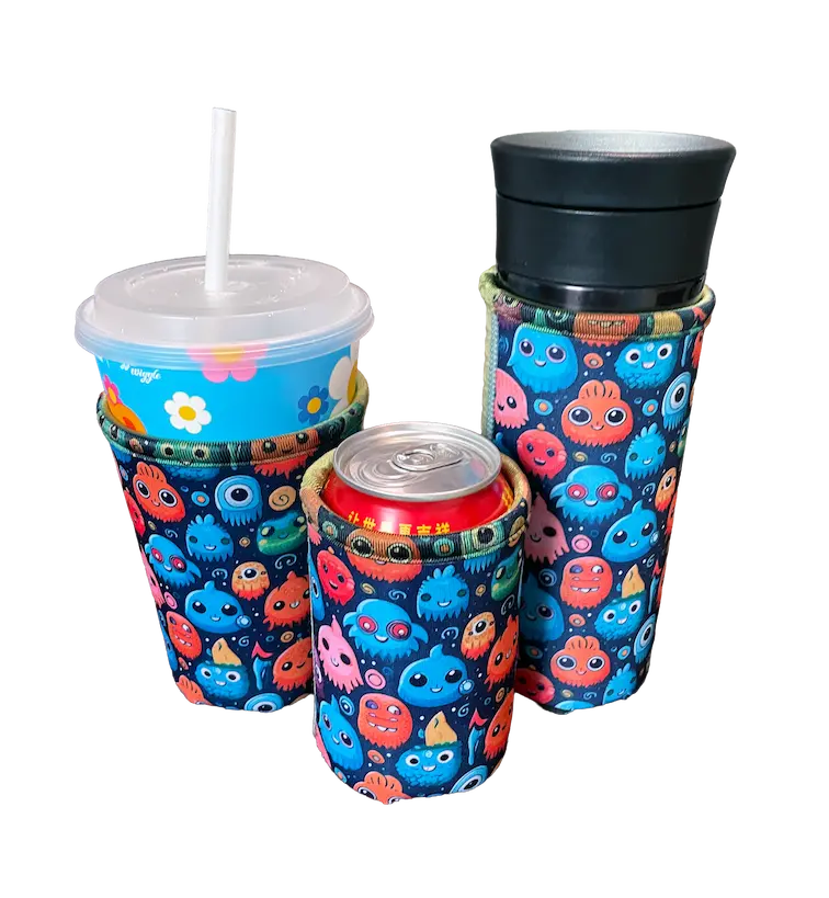 A professional lineup of vibrant monster-patterned neoprene koozies, including 15.0cm bottle sleeves, 12oz can coolers, and tapered coffee koozies, showcasing the 100% color vibrancy and consistent HD printing quality of NeopreneX factory-direct blanks.