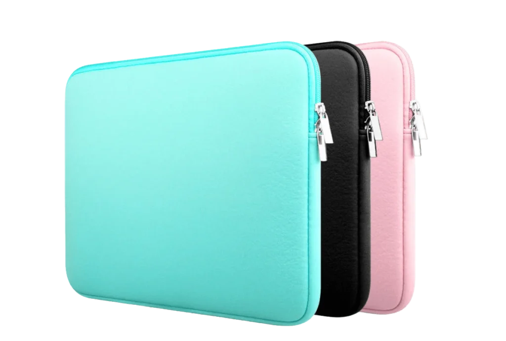 A stack of three classic plain zippered neoprene laptop sleeves in mint green, black, and pink, showing the metallic zipper pulls and padded structured profile for bulk wholesale.