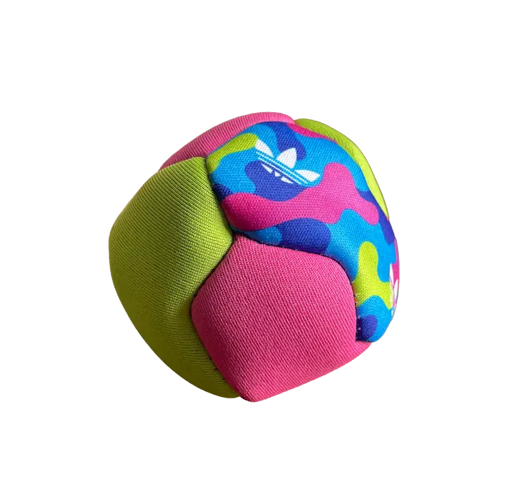 Colorful neoprene ball featuring multi-panel construction, demonstrating why neoprene is a functional material for outdoor activities like beach footbag play.