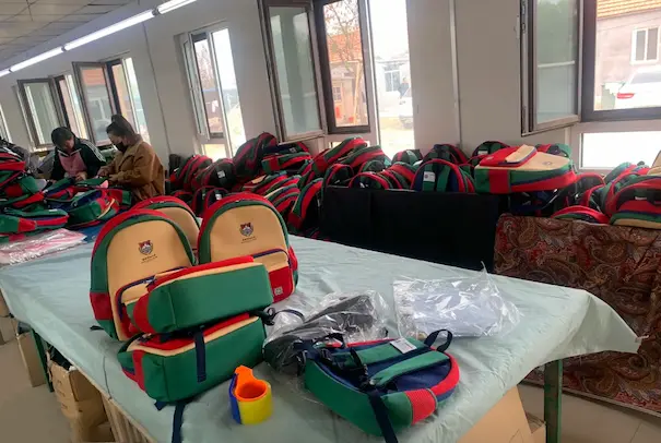 NeopreneX factory wholesale packaging workshop demonstrating bulk oem order manufacturing for custom kids backpacks.