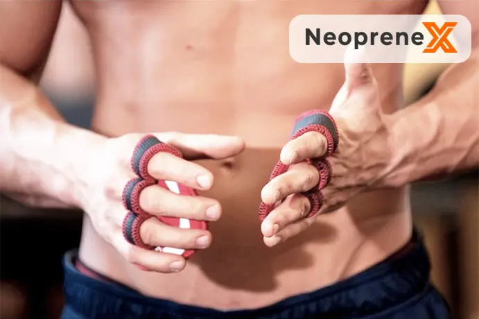 An athlete demonstrating the unique multi-finger loop design of NeopreneX minimalist neoprene training gloves, highlighting the flexible red-and-black contrast bound edges and a completely exposed back of the hand for maximum breathability.